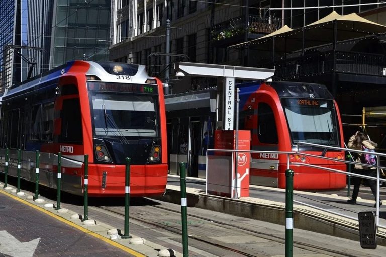 red trains at a stop